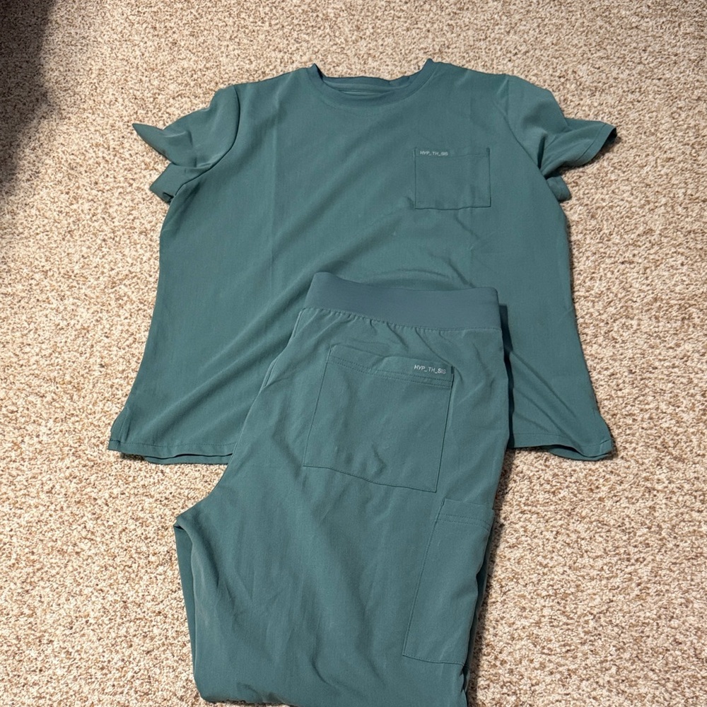 Women’s Hypothesis scrub set. 
Top has small bleach stains.